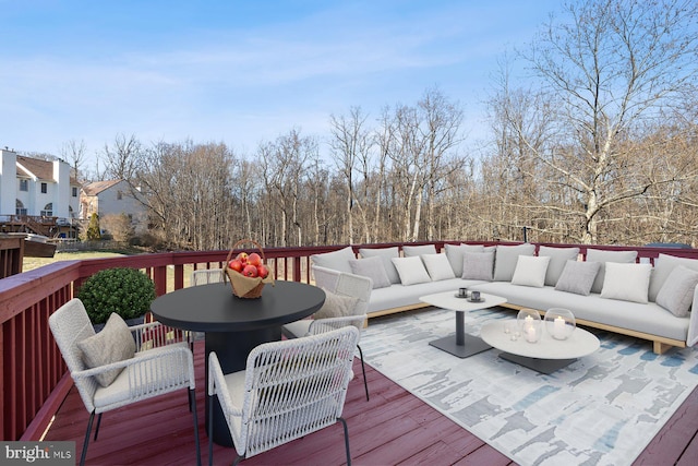 wooden deck featuring outdoor lounge area