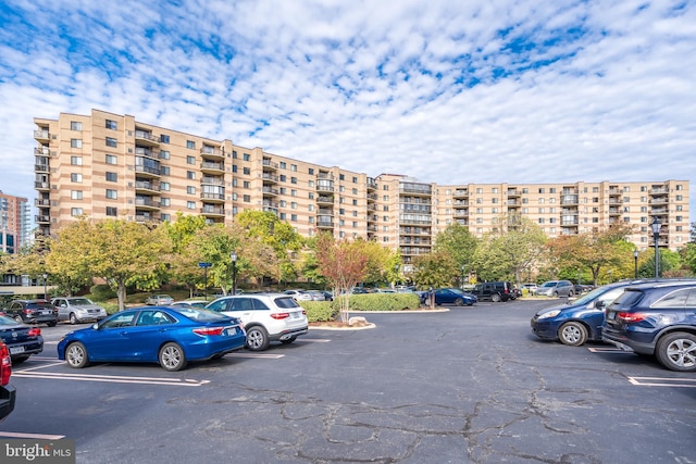 view of building exterior featuring uncovered parking