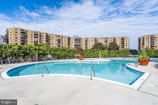 community pool with a patio