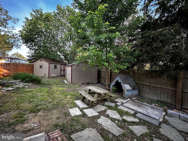 123 Meadowbrooke Pl, Winchester, VA 22602 - fenced backyard featuring a storage unit and an outdoor structure