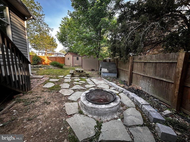 123 Meadowbrooke Pl, Winchester, VA 22602 - fenced backyard featuring an outdoor fire pit, a storage shed, an outdoor structure, and a patio
