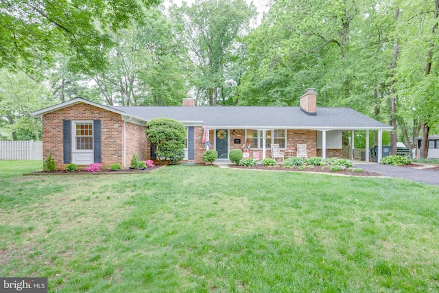 8605 Virginia Ave, Annandale, VA 22003 - ranch-style home with a chimney, brick siding, covered porch, asphalt driveway, and an attached carport