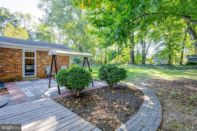 8605 Virginia Ave, Annandale, VA 22003 - wooden deck with a patio area and a lawn