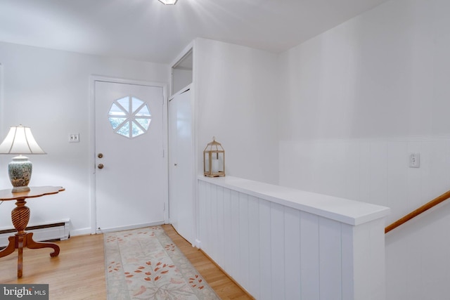 8605 Virginia Ave, Annandale, VA 22003 - entryway with light wood-style floors, wainscoting, and a baseboard heating unit