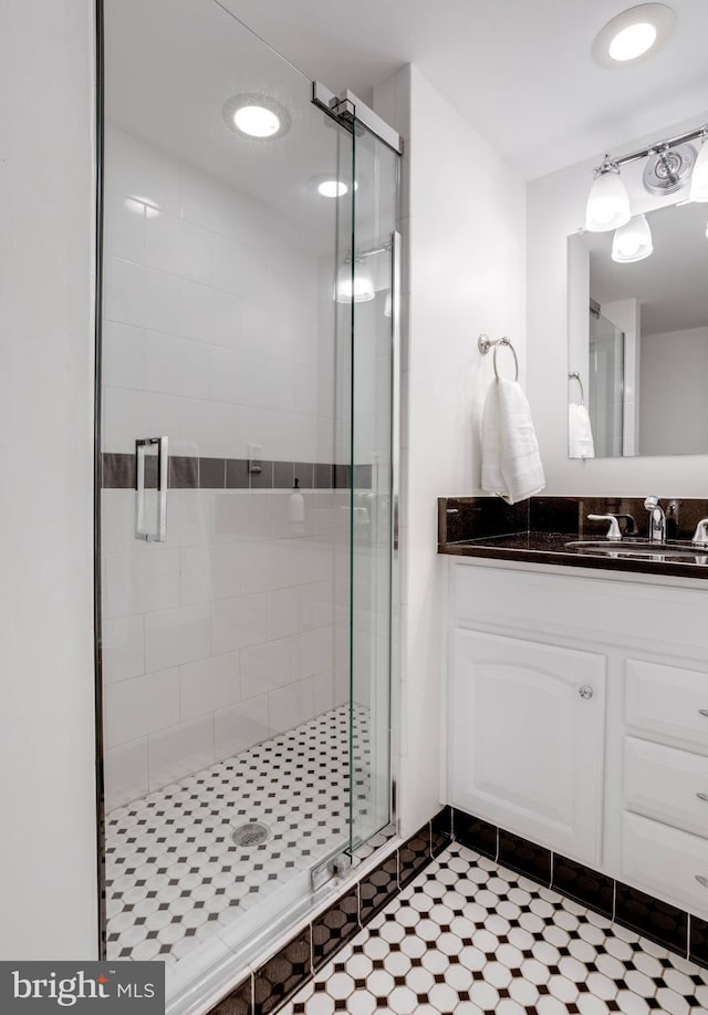 8605 Virginia Ave, Annandale, VA 22003 - bathroom featuring a shower stall, vanity, and tile patterned floors