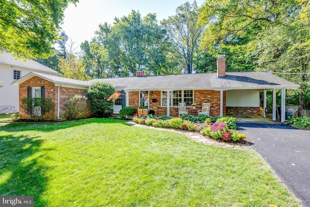 8605 Virginia Ave, Annandale, VA 22003 - ranch-style home featuring driveway, a chimney, a front yard, and brick siding