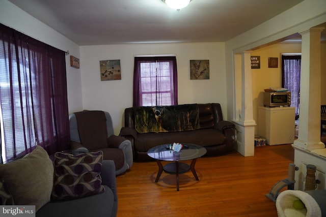 185 Middleway, Inwood, WV 25428 - living room featuring decorative columns and wood finished floors