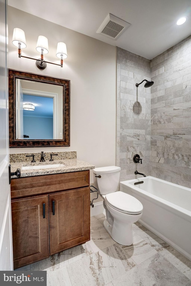 bathroom featuring visible vents, toilet, shower / bath combination, and vanity