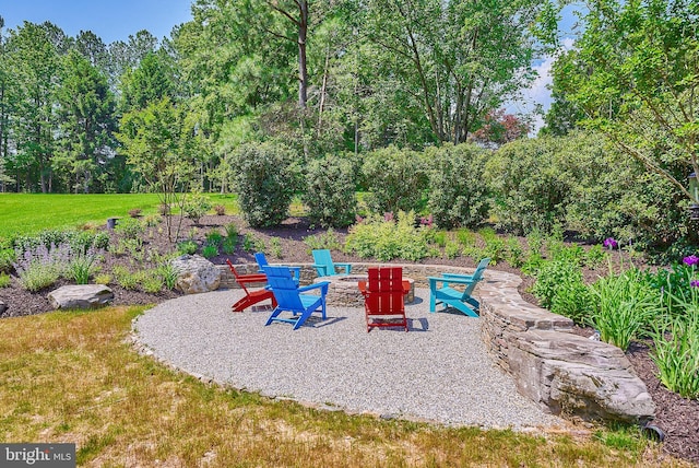 view of patio with a fire pit