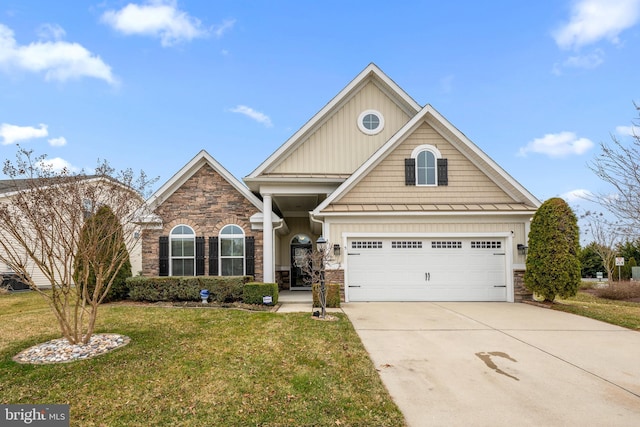 craftsman-style home featuring an attached garage, board and batten siding, a front lawn, stone siding, and driveway