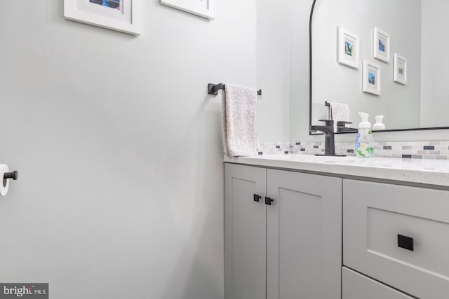 bathroom with backsplash and vanity