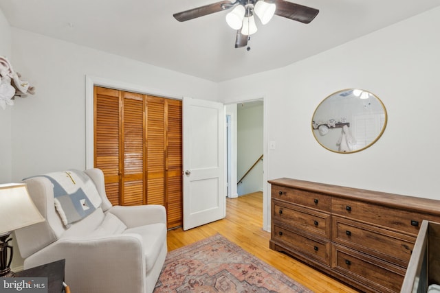 sitting room featuring a ceiling fan and light wood-style floors