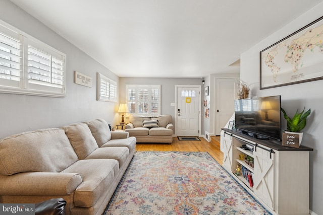 living room with light wood-style floors