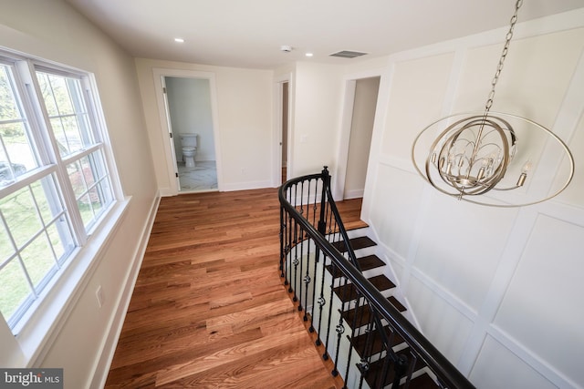 11 Hendrickson, Lawrenceville, NJ 08648 - stairway featuring baseboards, visible vents, recessed lighting, a notable chandelier, and wood finished floors