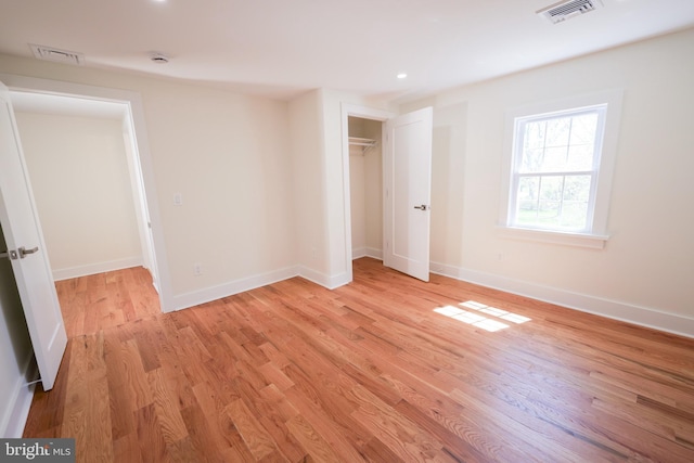 11 Hendrickson, Lawrenceville, NJ 08648 - unfurnished bedroom with a closet, visible vents, light wood finished floors, and baseboards