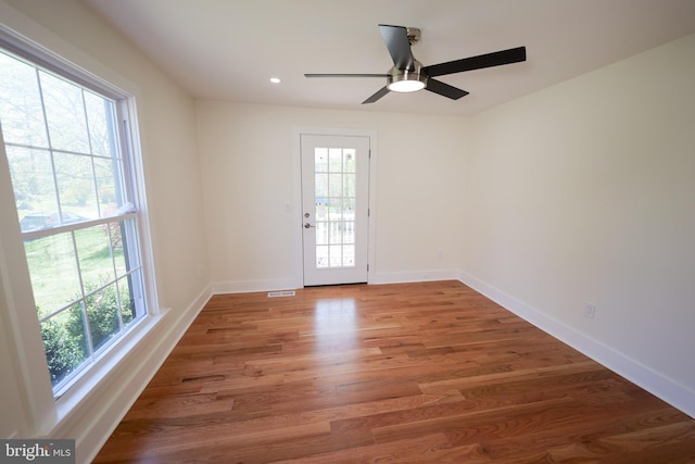 11 Hendrickson, Lawrenceville, NJ 08648 - unfurnished room with plenty of natural light, baseboards, and wood finished floors