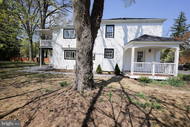 11 Hendrickson, Lawrenceville, NJ 08648 - view of front facade featuring a balcony, a porch, and fence