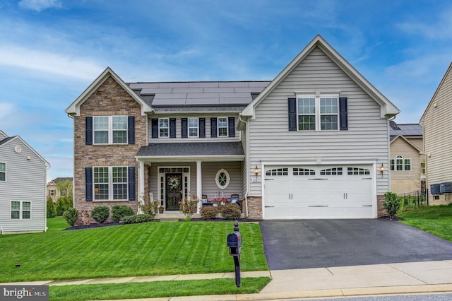 10437 Windlass Run Rd, Baltimore, MD 21220 - view of front of house with a front yard, a porch, stone siding, and aphalt driveway
