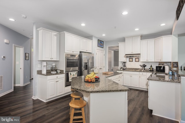 10437 Windlass Run Rd, Baltimore, MD 21220 - kitchen featuring appliances with stainless steel finishes, backsplash, and white cabinets