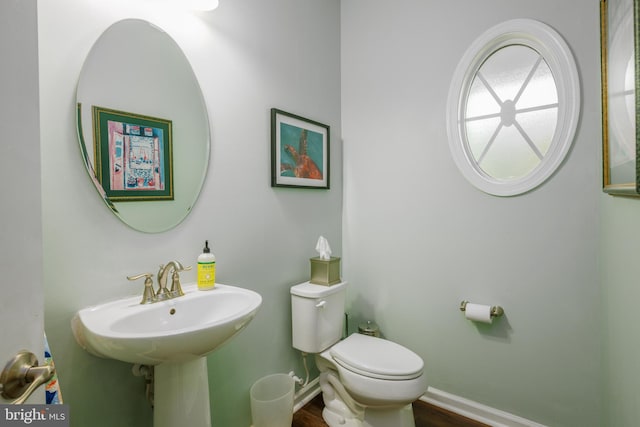 10437 Windlass Run Rd, Baltimore, MD 21220 - half bathroom with toilet and wood finished floors
