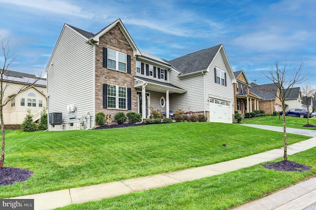 10437 Windlass Run Rd, Baltimore, MD 21220 - craftsman inspired home featuring a garage, a front yard, central air condition unit, and stone siding