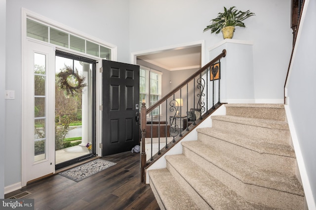 10437 Windlass Run Rd, Baltimore, MD 21220 - entryway featuring ornamental molding, visible vents, wood finished floors, stairs, and baseboards