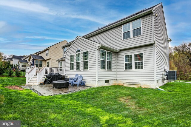 10437 Windlass Run Rd, Baltimore, MD 21220 - rear view of house featuring a patio area, a yard, and an outdoor fire pit