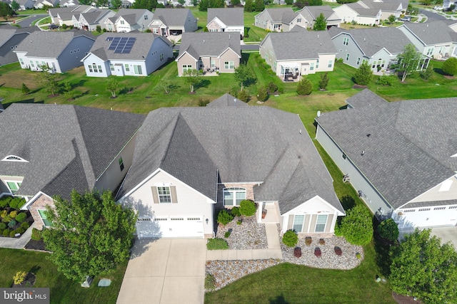 birds eye view of property with a residential view