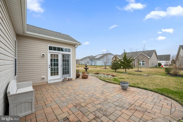 view of patio featuring french doors and a residential view