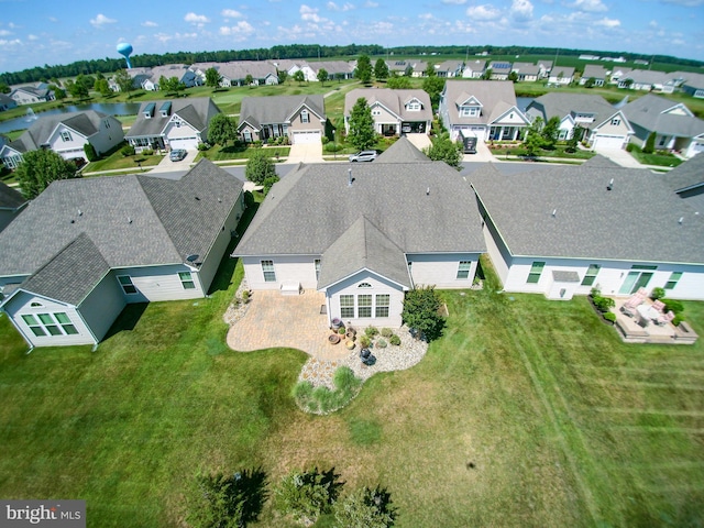 birds eye view of property with a residential view