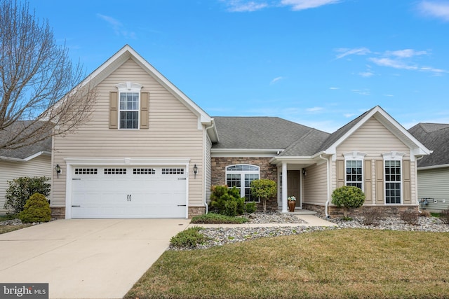 traditional home with a front yard, driveway, an attached garage, a shingled roof, and stone siding