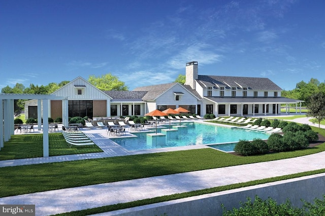 pool with a patio area and a lawn