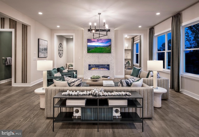 living area featuring a notable chandelier, recessed lighting, and wood finished floors