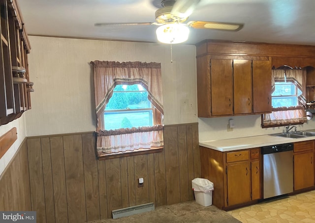 kitchen featuring brown cabinetry, dishwasher, a ceiling fan, and a healthy amount of sunlight