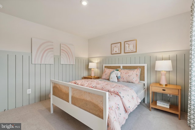 bedroom featuring carpet floors and wainscoting