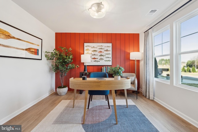 office featuring light wood-style floors, visible vents, and baseboards