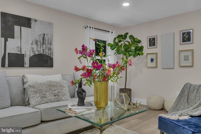 interior space featuring recessed lighting, baseboards, and wood finished floors