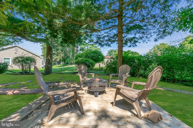 view of patio with a fire pit