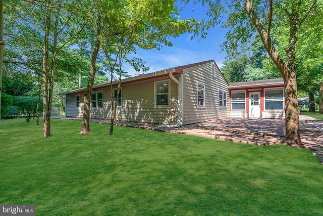 single story home featuring a patio and a front lawn