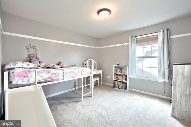 carpeted bedroom with baseboards