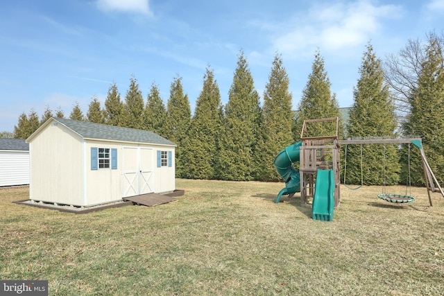 exterior space featuring an outbuilding, a playground, and a storage unit