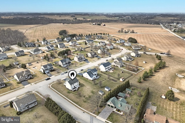 birds eye view of property with a rural view and a residential view