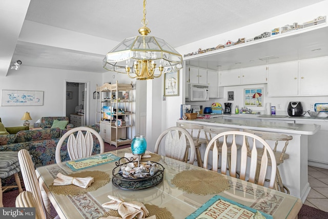 9400 Coastal Hwy Unit 1901, Ocean City, MD 21842 - dining space with light tile patterned floors and a notable chandelier