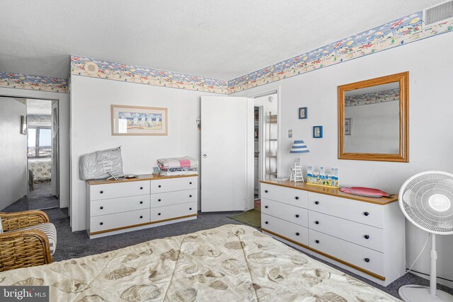 9400 Coastal Hwy Unit 1901, Ocean City, MD 21842 - bedroom featuring visible vents, carpet floors, and a textured ceiling