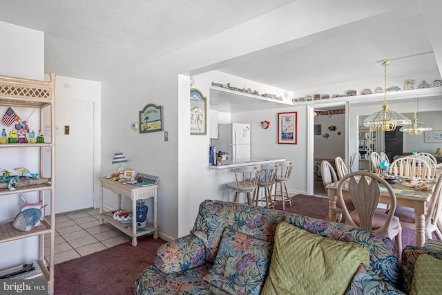 9400 Coastal Hwy Unit 1901, Ocean City, MD 21842 - living room featuring tile patterned floors, a notable chandelier, and a textured ceiling