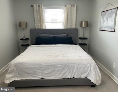 carpeted bedroom with baseboards