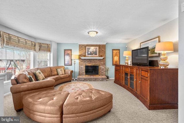 living room with light carpet, a fireplace, and baseboards