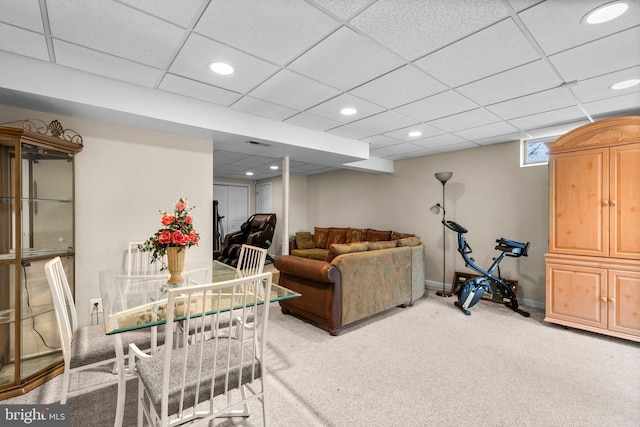 carpeted living room with recessed lighting, visible vents, baseboards, and a drop ceiling