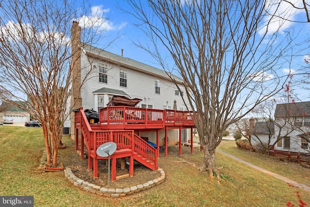 back of property with stairs, a yard, a wooden deck, and a chimney