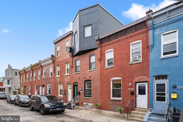 exterior space featuring brick siding and entry steps